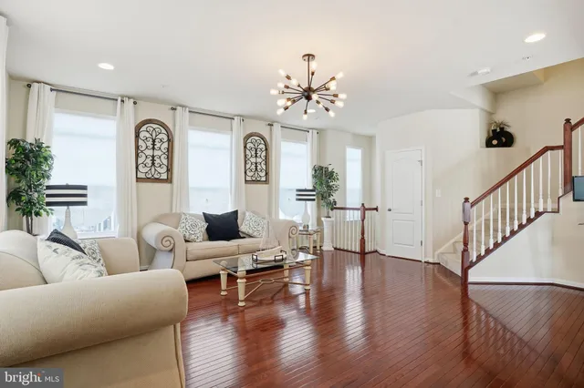 a living room with furniture with wooden floor