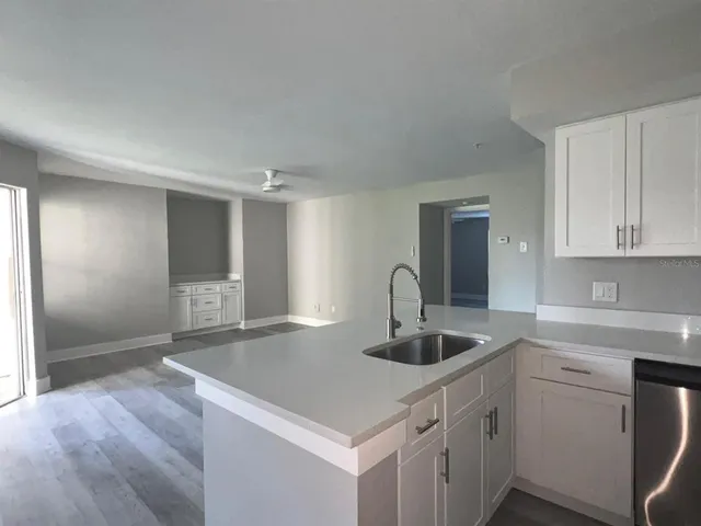 a view with a sink and cabinet