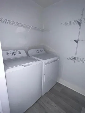 a kitchen with cabinets stainless steel appliances and a sink