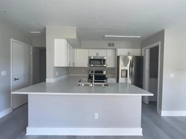 a view of a chairs and table in backyard