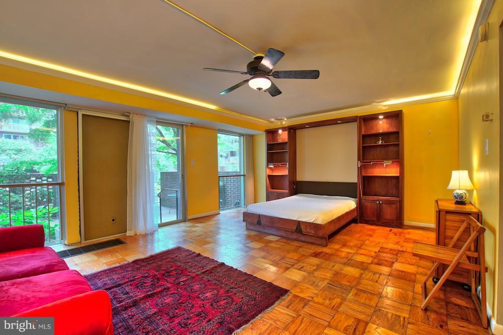 520 N Street Southwest, Unit S112 Washington, DC 20024 - Photo 11 of 30 a bedroom with a large bed and large windows