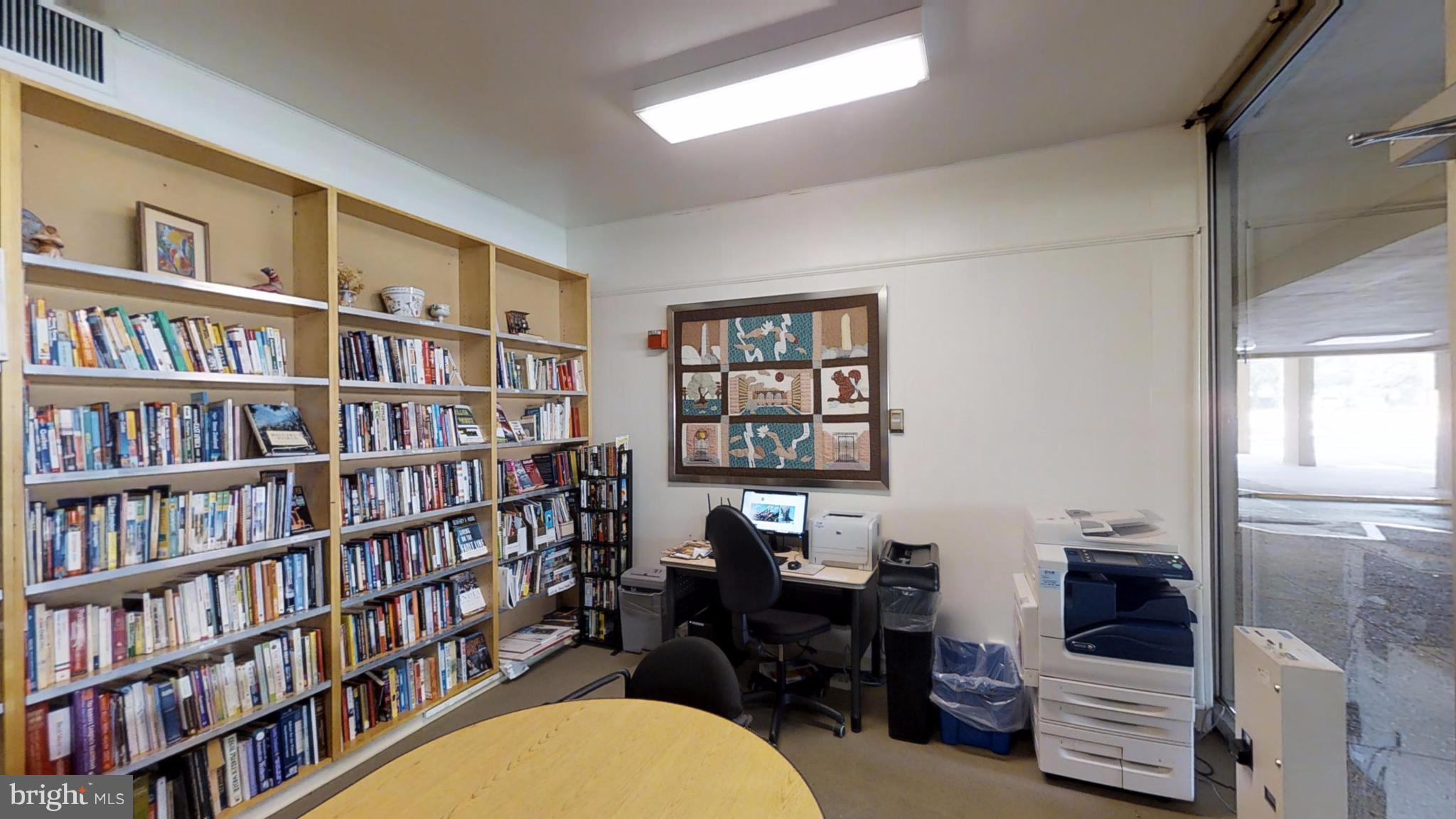 520 N Street Southwest, Unit S112 Washington, DC 20024 - Photo 28 of 30 a view of a workspace with bookshelf