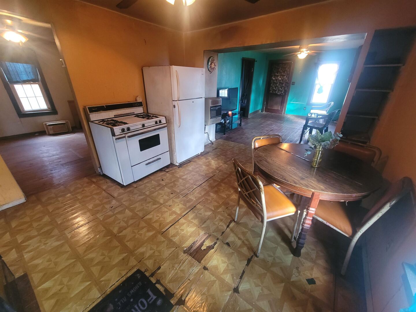 108 North Walnut Street McLeansboro, IL 62859 - Photo 11 of 25 a kitchen with stainless steel appliances kitchen island granite countertop a stove refrigerator and microwave