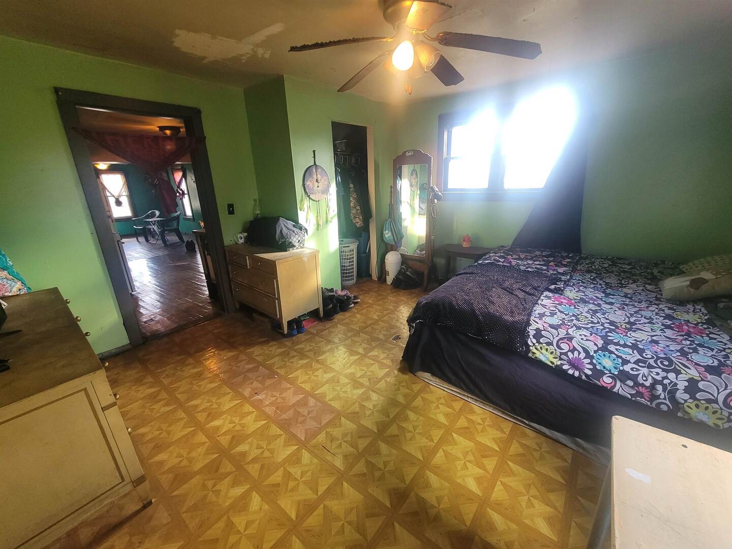 108 North Walnut Street McLeansboro, IL 62859 - Photo 13 of 25 a bedroom with a bed and a chandelier