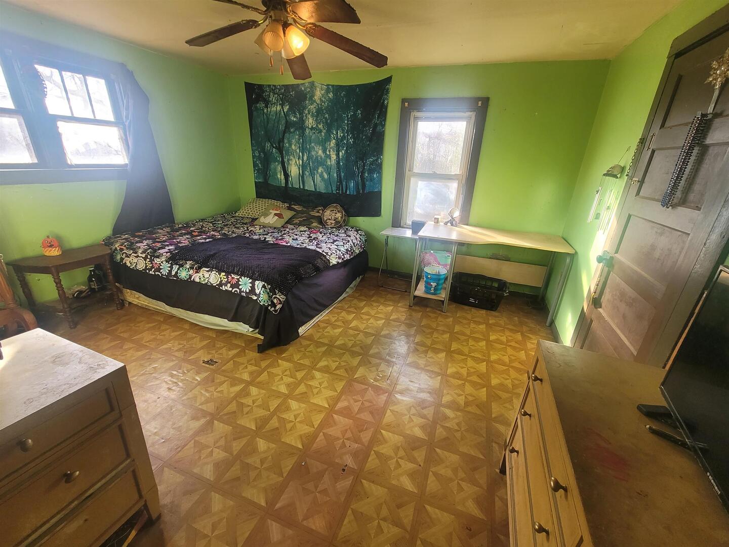 108 North Walnut Street McLeansboro, IL 62859 - Photo 14 of 25 a bedroom with a bed and a fireplace