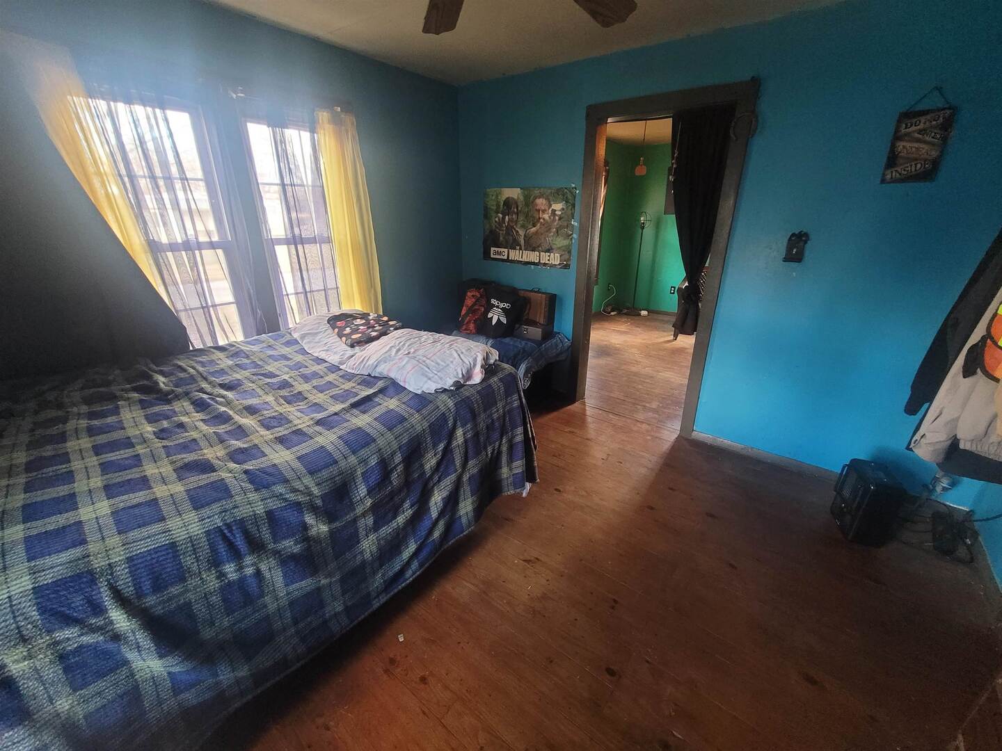 108 North Walnut Street McLeansboro, IL 62859 - Photo 21 of 25 a bed sitting in a bedroom next to a window