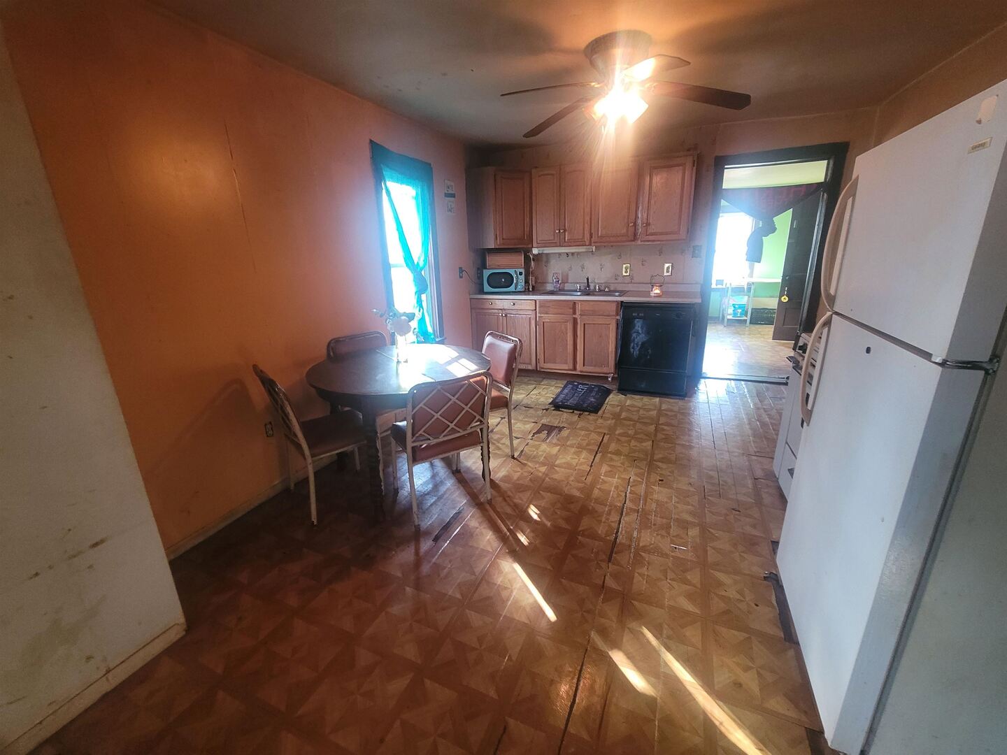 108 North Walnut Street McLeansboro, IL 62859 - Photo 9 of 25 a living room with stainless steel appliances furniture a rug and a kitchen view