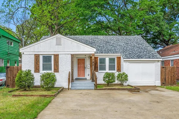 front view of a house that has a yard