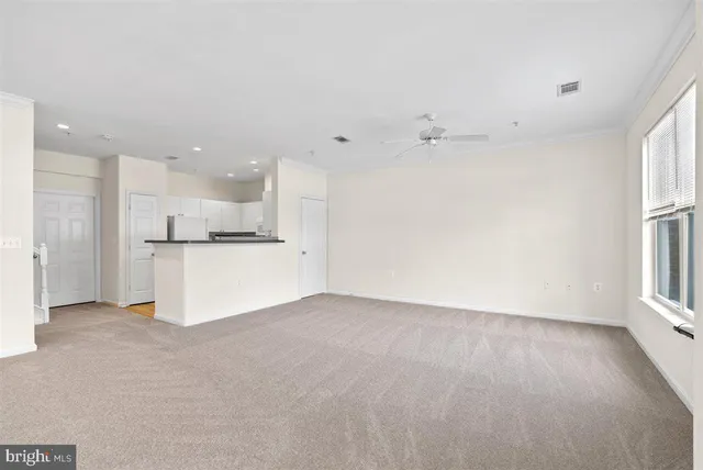a view of a kitchen with a sink and a window