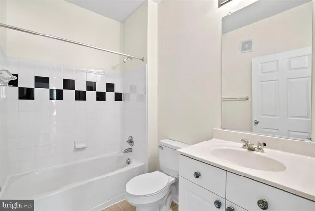 a bathroom with a sink a toilet and a bathtub