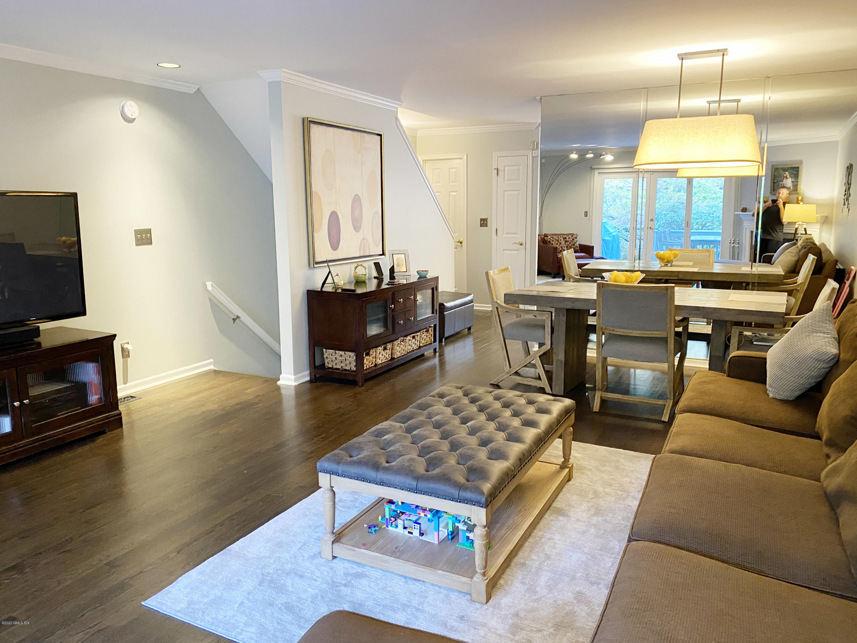 a living room with fireplace furniture and a flat screen tv