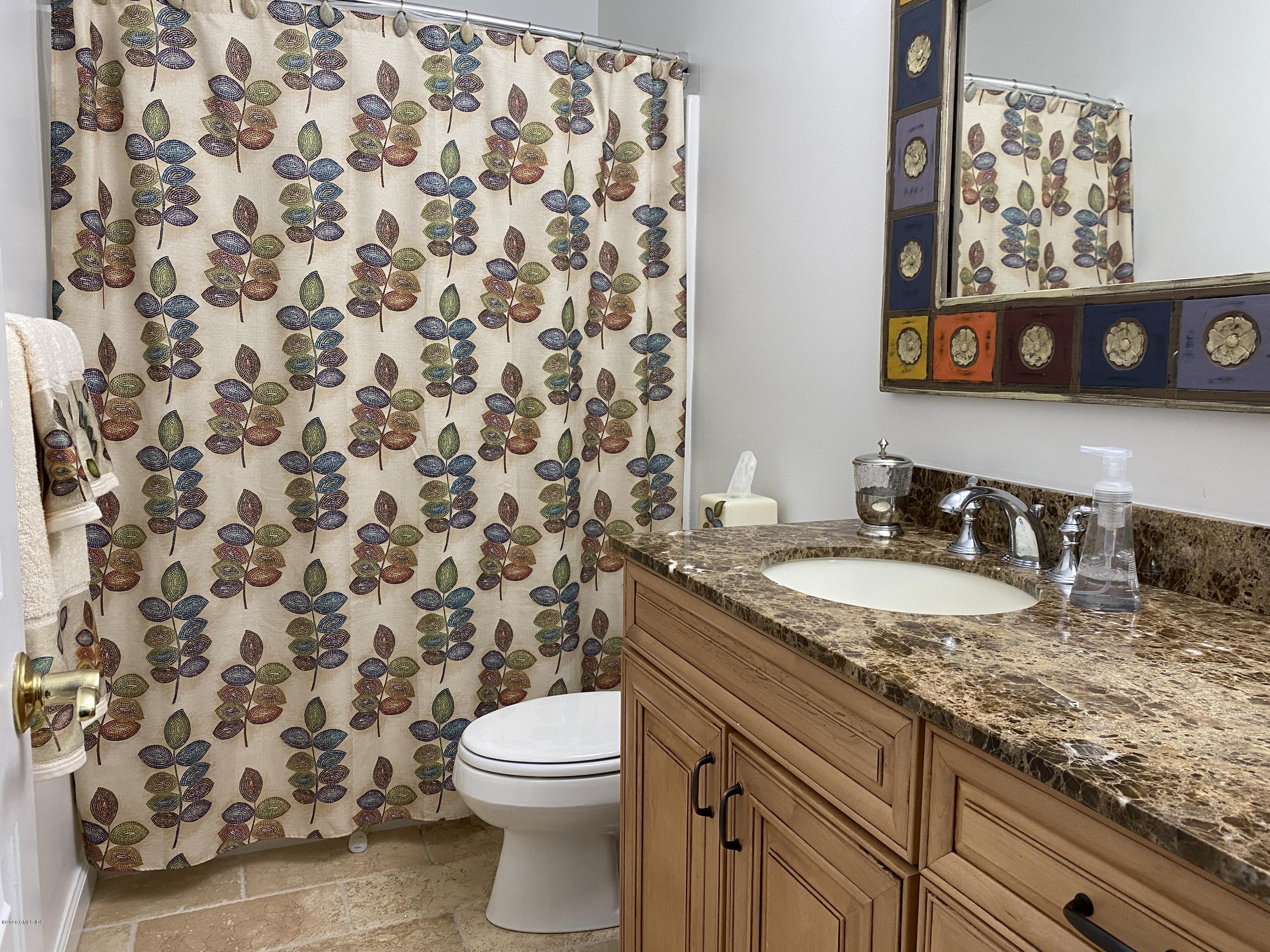 351 Pemberwick Road, Unit 607 Greenwich, CT 06831 - Photo 15 of 21 a bathroom with a granite countertop sink and a toilet