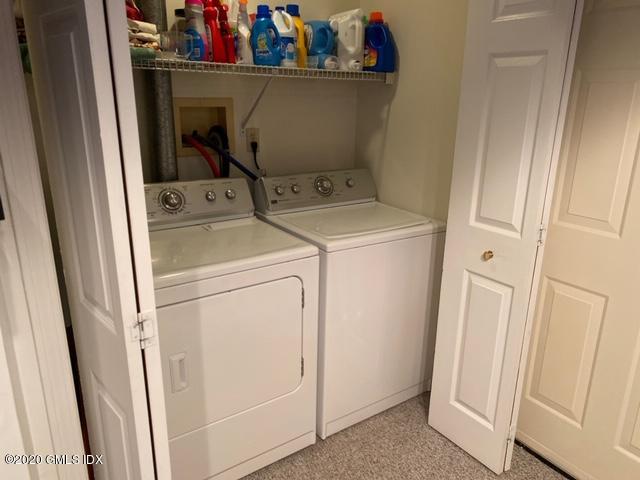 351 Pemberwick Road, Unit 607 Greenwich, CT 06831 - Photo 17 of 21 a utility room with dryer and washer