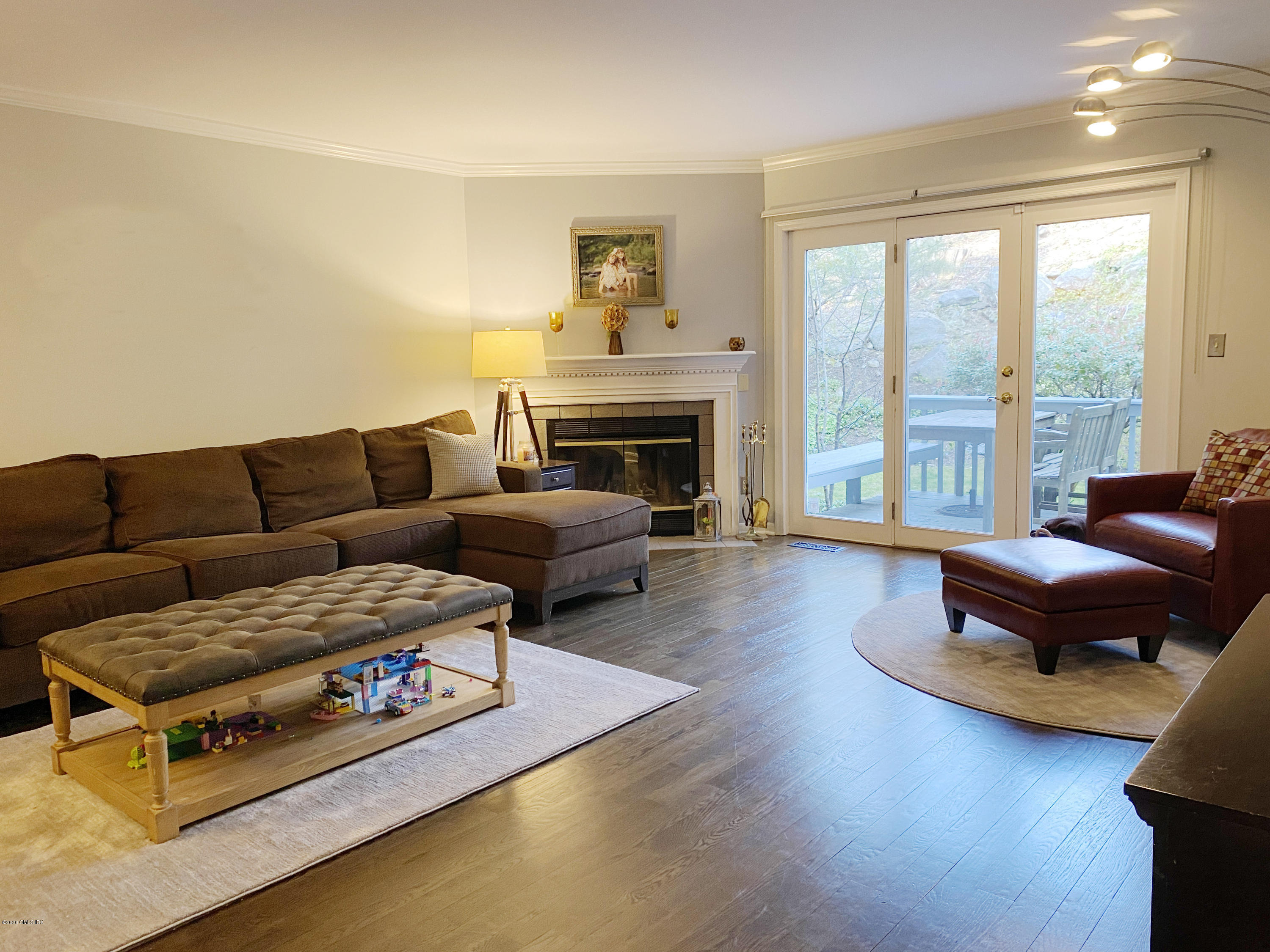 351 Pemberwick Road, Unit 607 Greenwich, CT 06831 - Photo 3 of 21 a living room with furniture and a fireplace