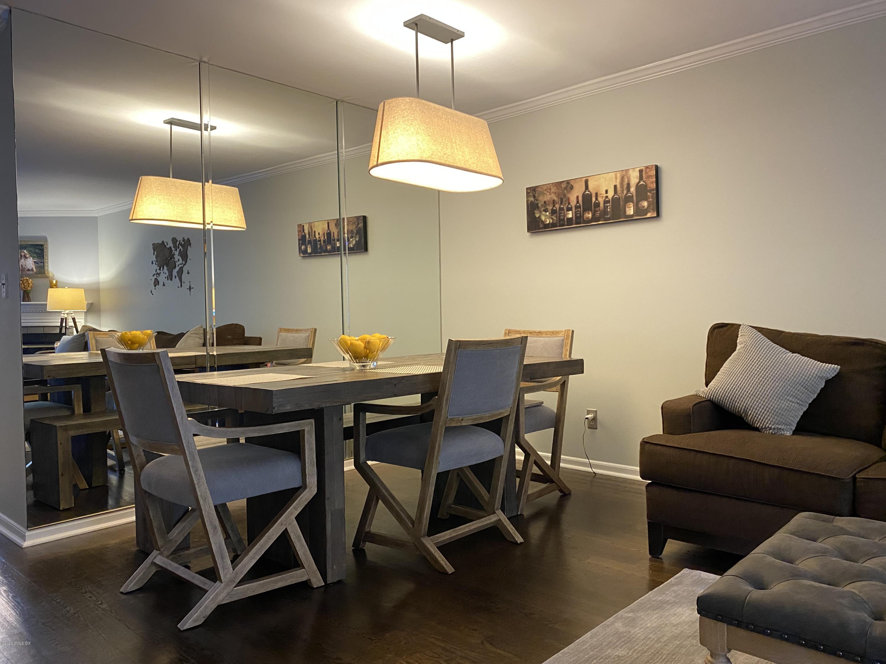 351 Pemberwick Road, Unit 607 Greenwich, CT 06831 - Photo 5 of 21 a view of a dining room with furniture
