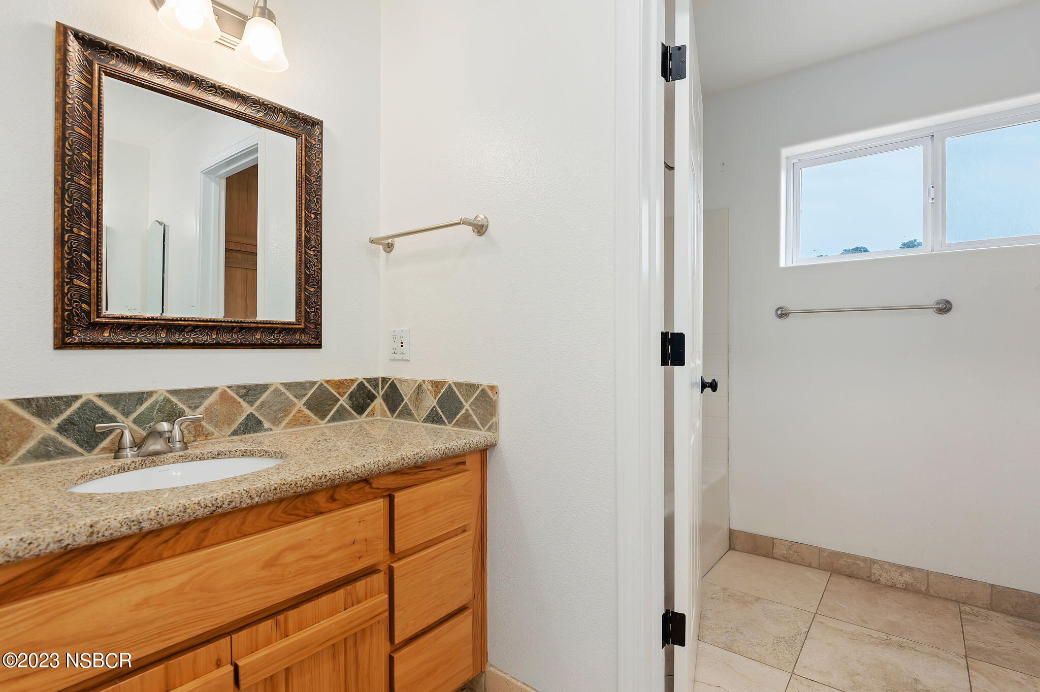 1180 Alamo Pintado Road Solvang, CA 93463 - Photo 14 of 20 a bathroom with a sink and a mirror