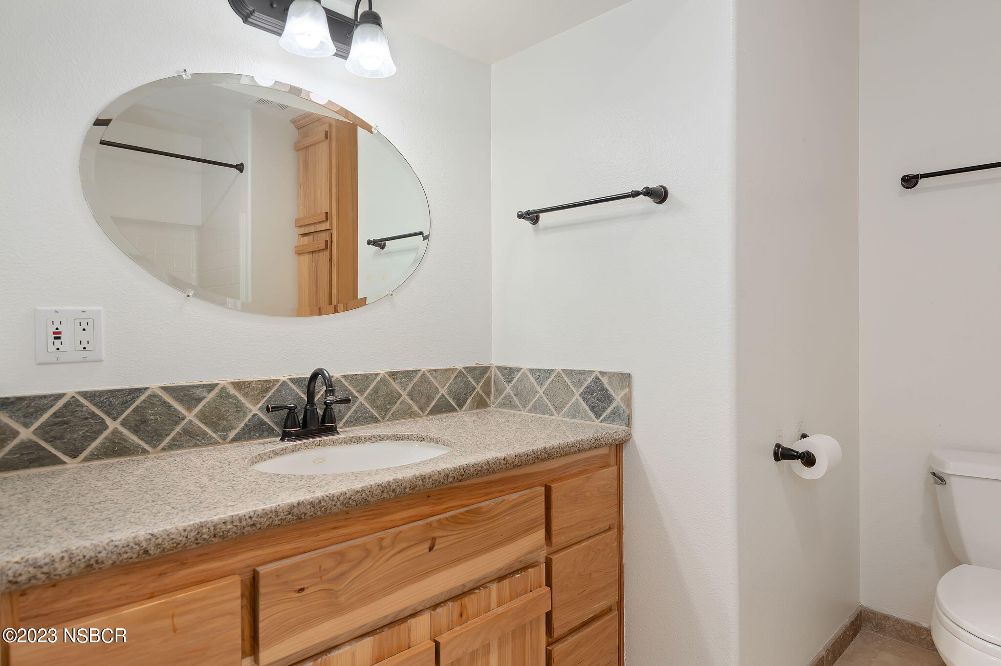 1180 Alamo Pintado Road Solvang, CA 93463 - Photo 15 of 20 a bathroom with a sink and mirror
