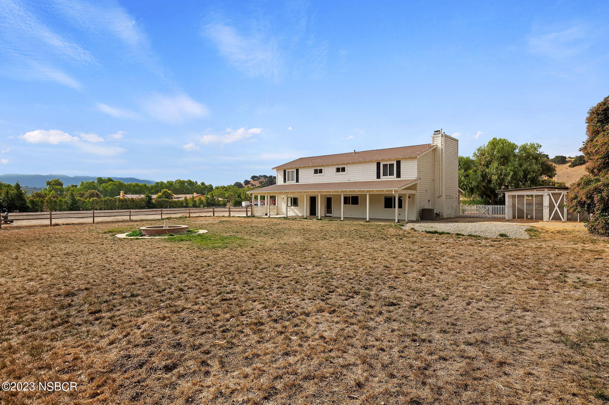 1180 Alamo Pintado Road Solvang, CA 93463 - Photo 16 of 20 a view of a house with a yard
