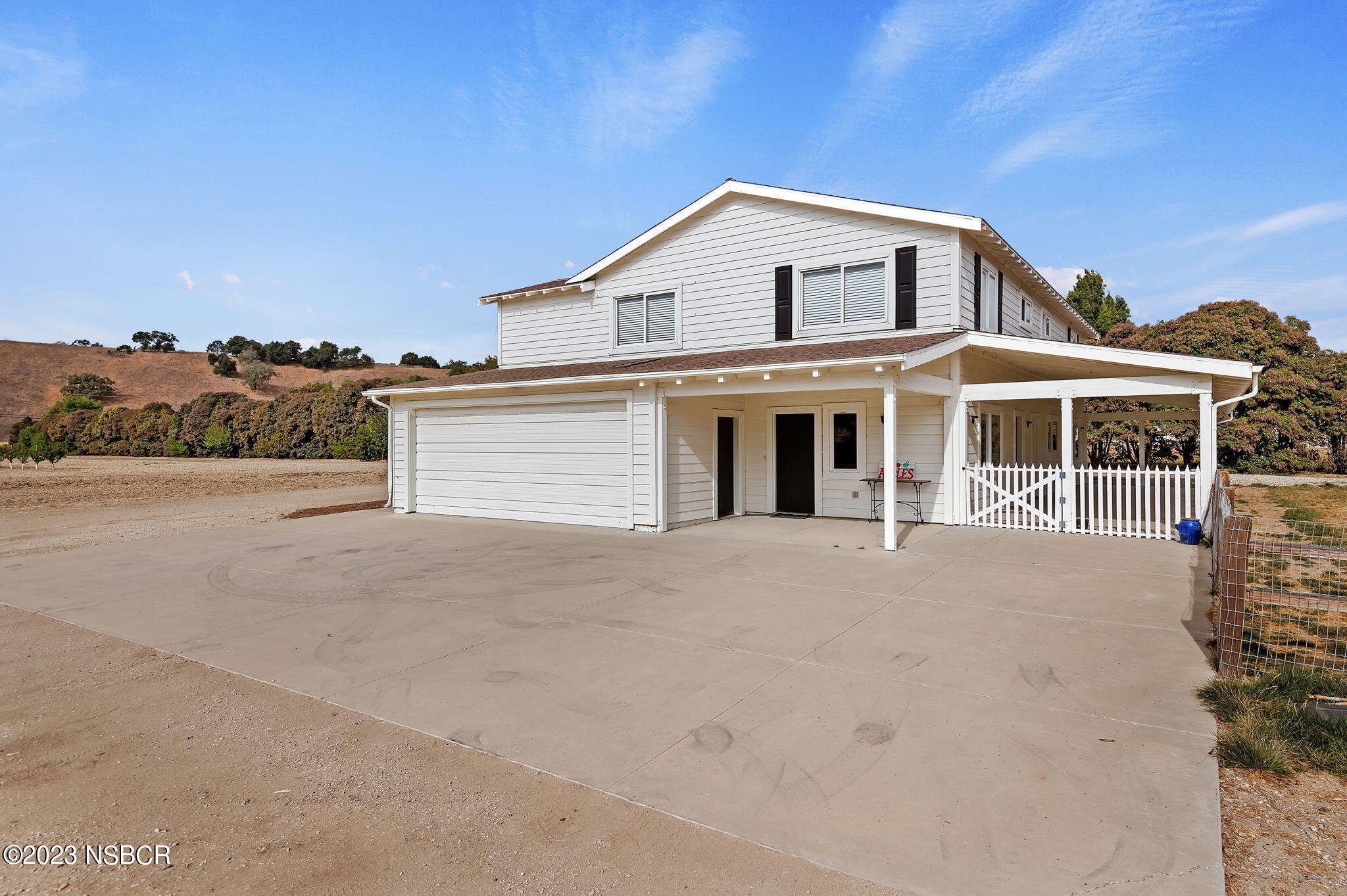 1180 Alamo Pintado Road Solvang, CA 93463 - Photo 2 of 20 a front view of a house with a yard and balcony