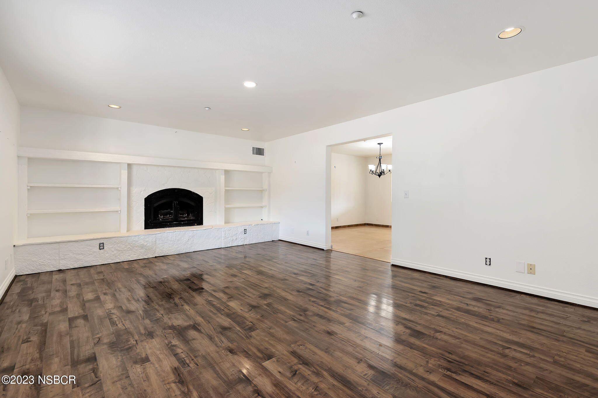 1180 Alamo Pintado Road Solvang, CA 93463 - Photo 3 of 20 an empty room with wooden floor and window