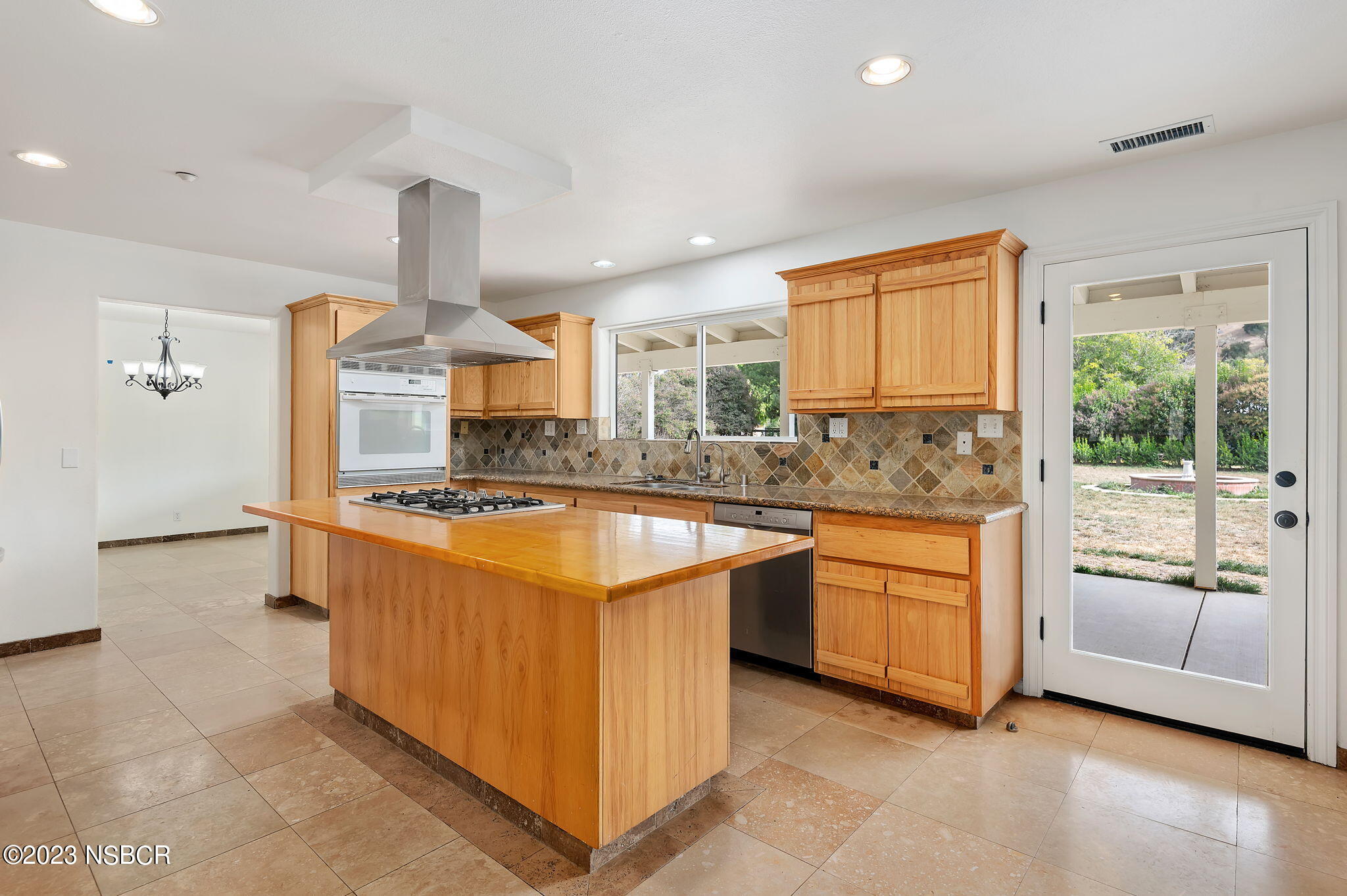 1180 Alamo Pintado Road Solvang, CA 93463 - Photo 5 of 20 a kitchen with stainless steel appliances granite countertop a sink and a stove
