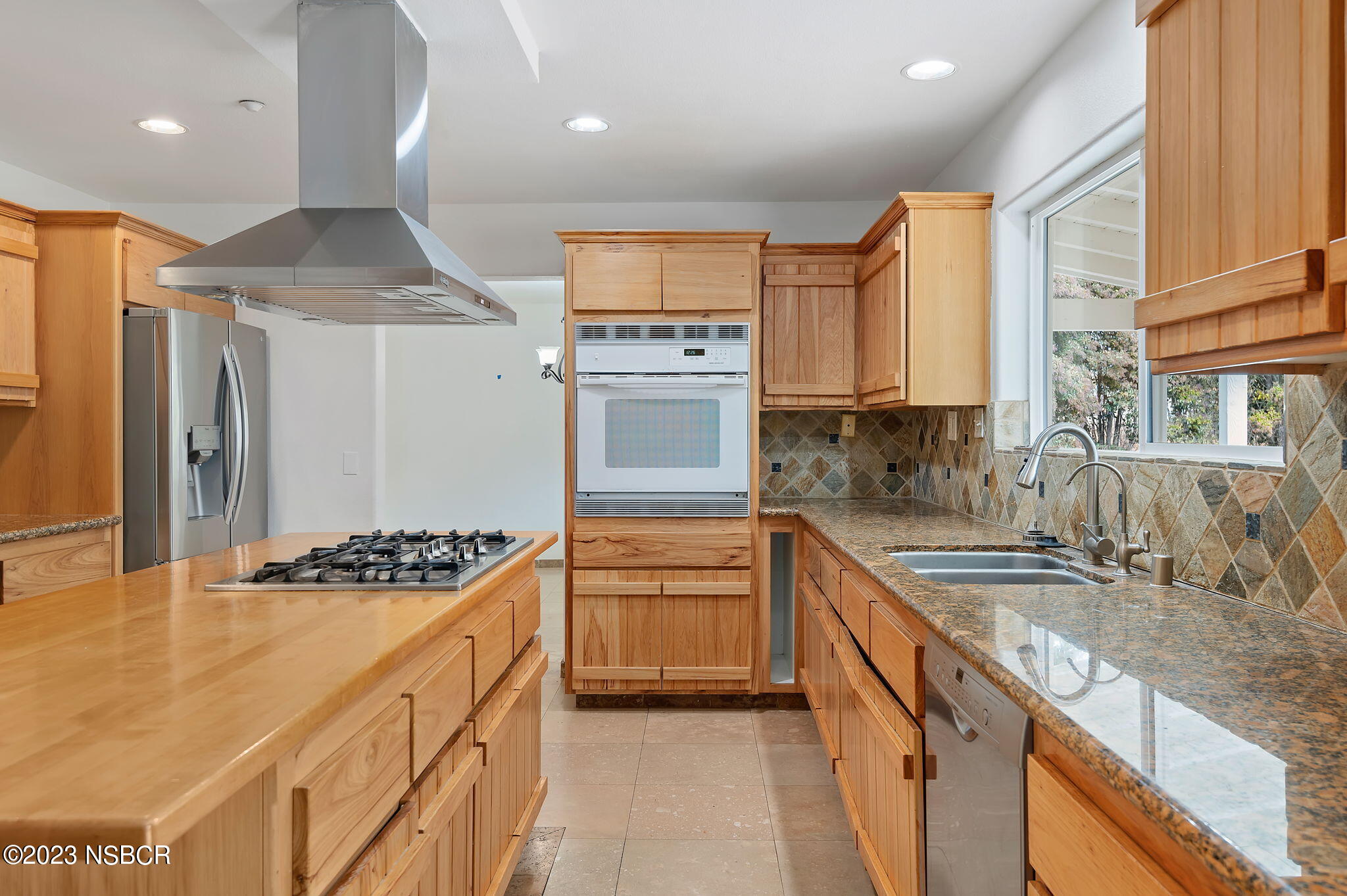 1180 Alamo Pintado Road Solvang, CA 93463 - Photo 6 of 20 a kitchen with stainless steel appliances granite countertop a sink stove and refrigerator