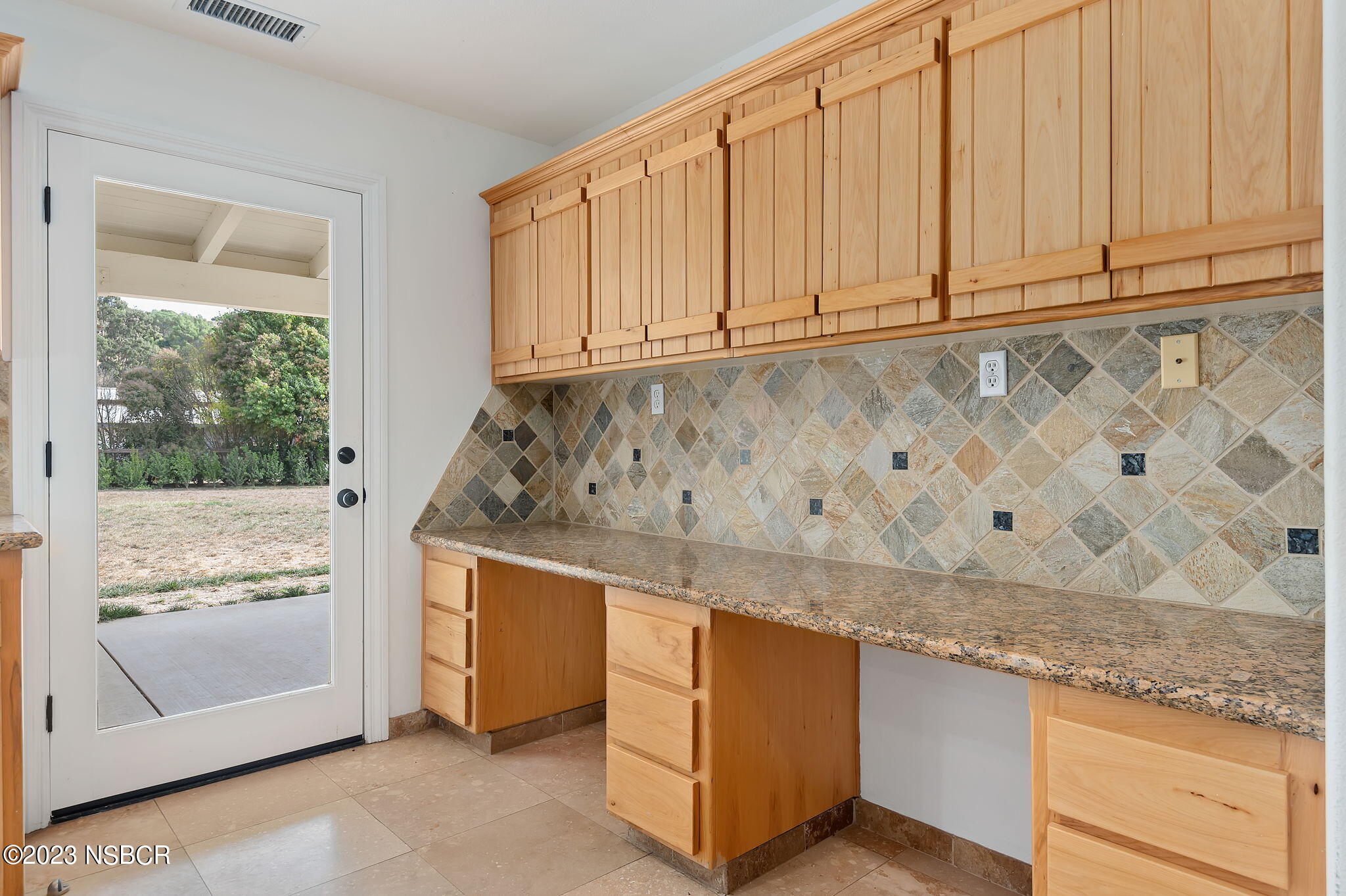1180 Alamo Pintado Road Solvang, CA 93463 - Photo 7 of 20 a kitchen with granite countertop white cabinets and white appliances