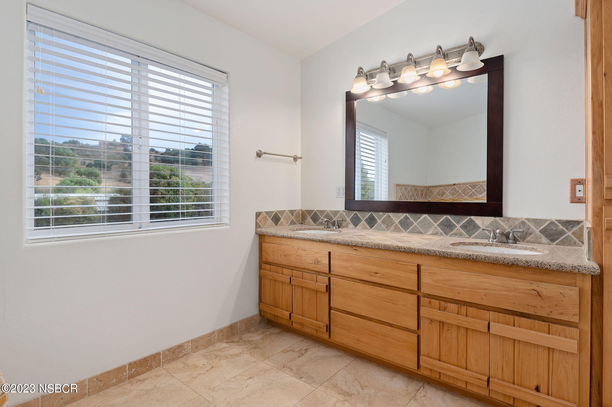 1180 Alamo Pintado Road Solvang, CA 93463 - Photo 10 of 20 a bathroom with a sink and a mirror