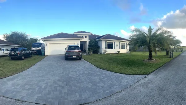 a house view with a garden space