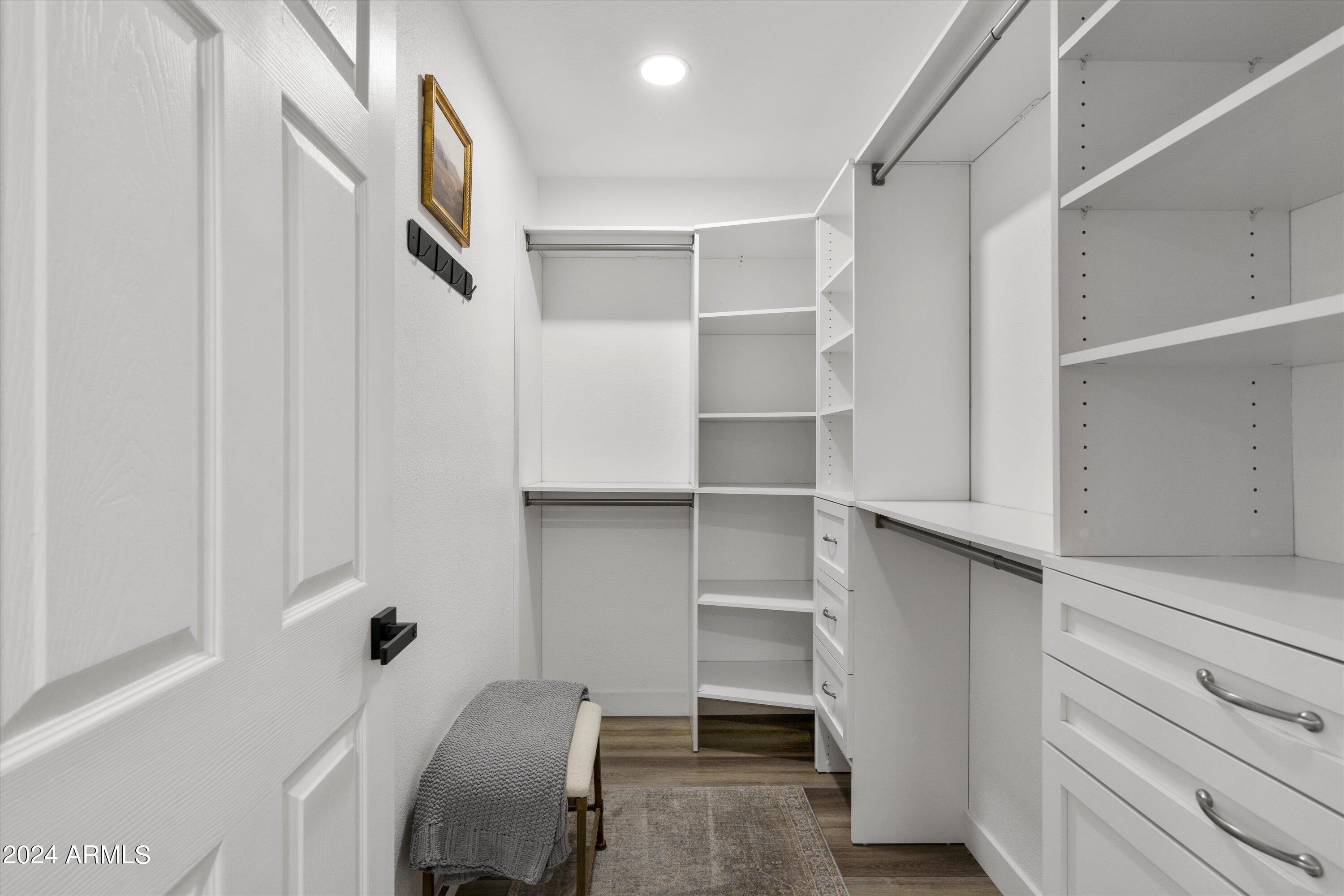 7709 West Boca Raton Road Peoria, AZ 85381 - Photo 25 of 45 Primary bedroom walk in closet built ins