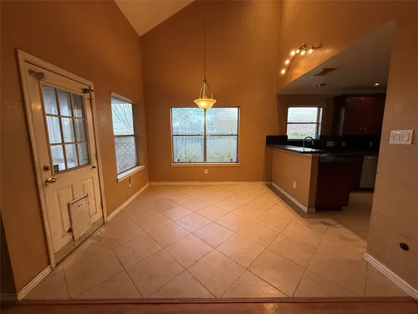 a view of a livingroom with a kitchen