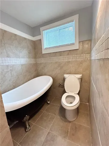 a bathroom with a toilet and a sink