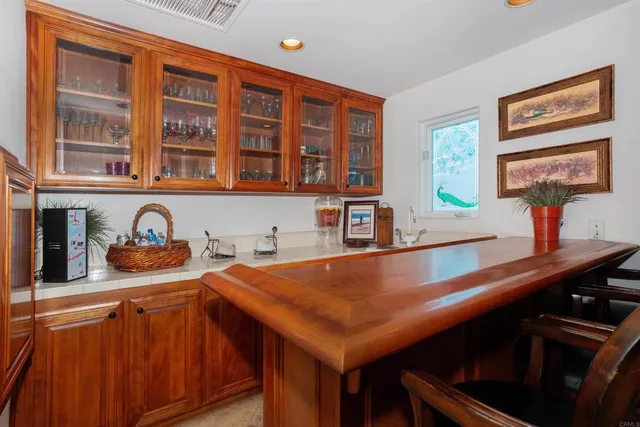a large white room with a large window and white cabinets
