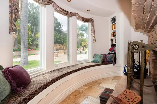a bathroom with a tub a sink and mirror