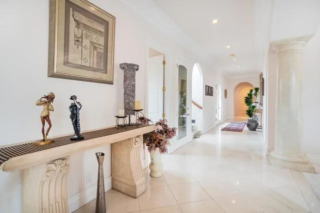 a kitchen with stainless steel appliances granite countertop a sink a stove a refrigerator and cabinets