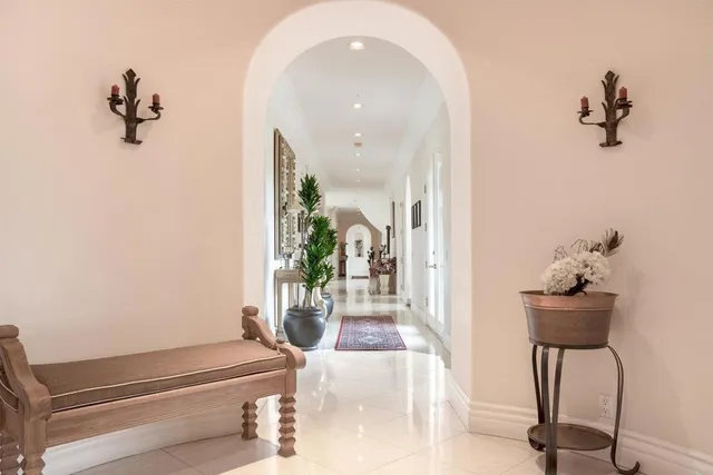a kitchen with granite countertop white cabinets and stainless steel appliances