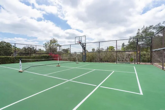 walk in closet with wooden floor