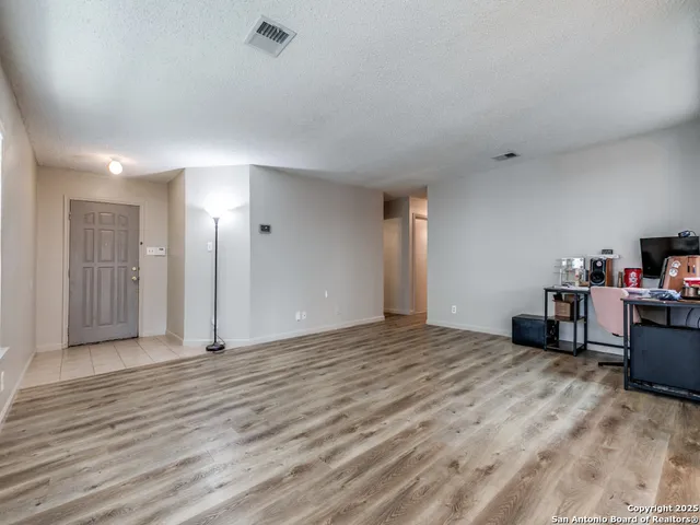 a view of a bedroom with a furniture and closet
