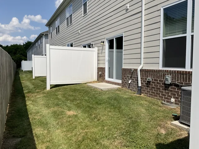 a view of a house with backyard
