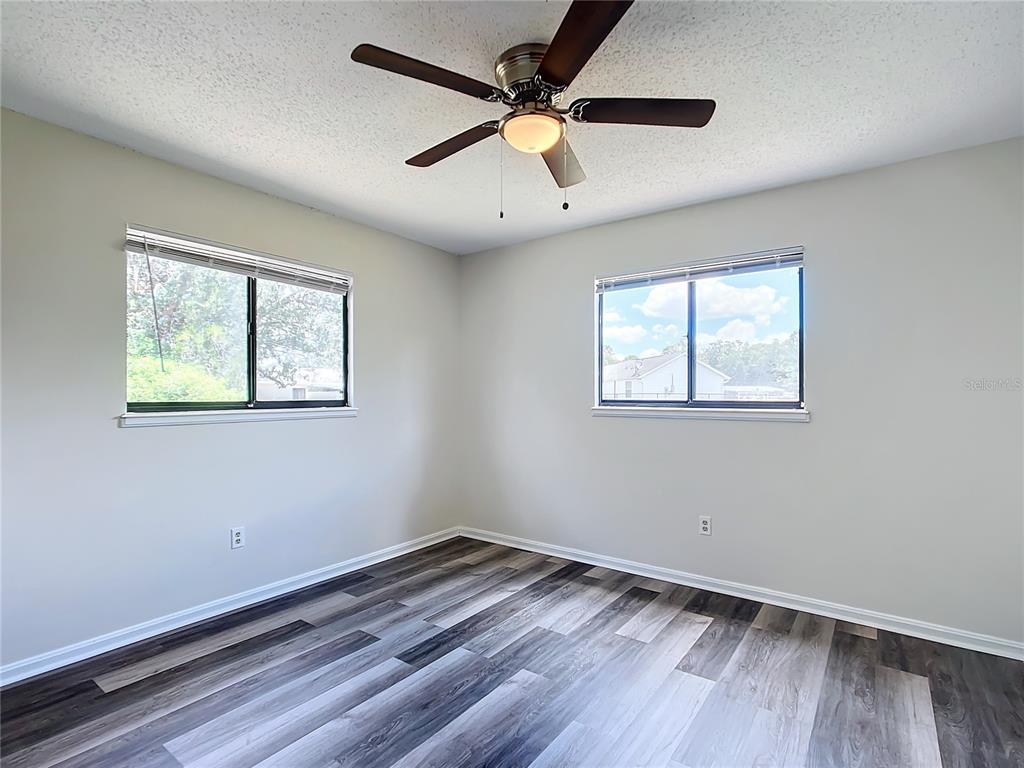 8917 Southwest 104th Place Ocala, FL 34481 - Photo 15 of 41 a view of empty room with wooden floor