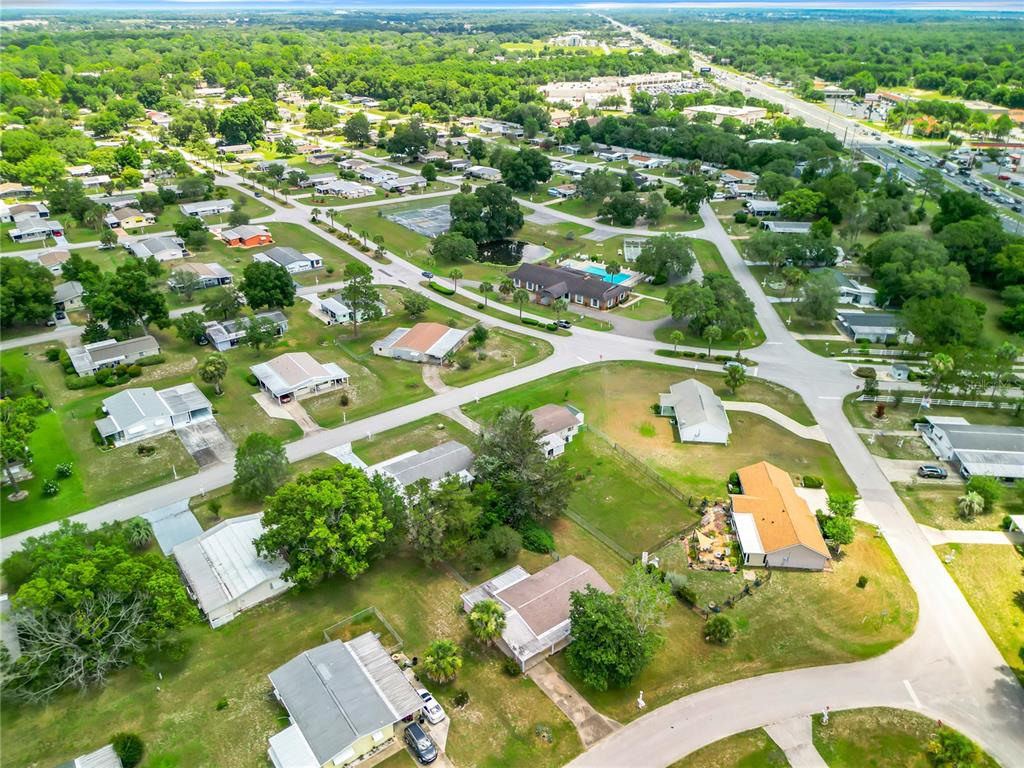 8917 Southwest 104th Place Ocala, FL 34481 - Photo 33 of 41 an aerial view of residential houses with outdoor space and swimming pool