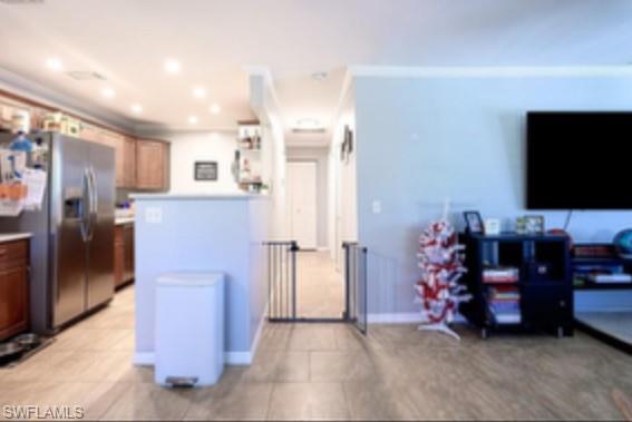 1369 Chesapeake Avenue, Unit B5 Naples, FL 34102 - Photo 5 of 15 a view of kitchen with furniture and refrigerator