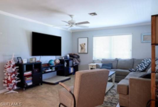 1369 Chesapeake Avenue, Unit B5 Naples, FL 34102 - Photo 6 of 15 a living room with furniture and a flat screen tv