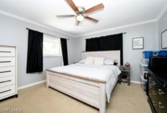 a spacious bedroom with a bed and a flat screen tv