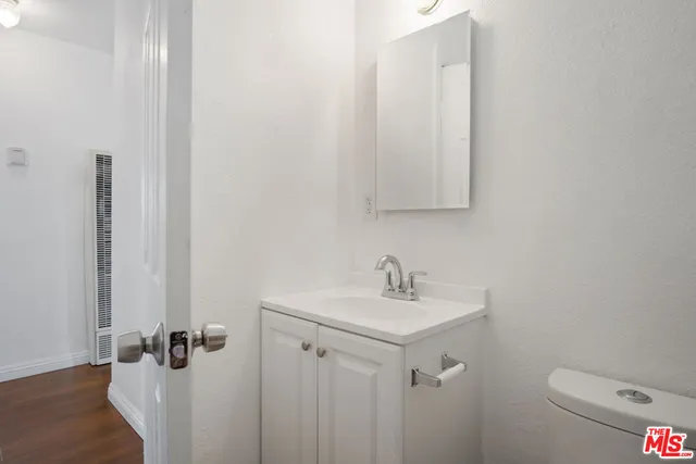 a bathroom with a sink toilet and vanity