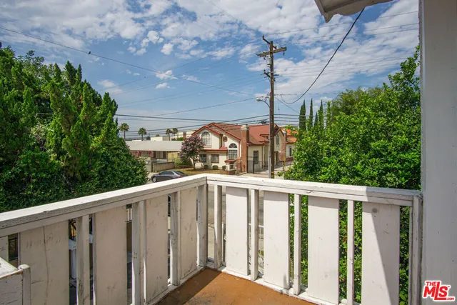 a view of balcony with furniture