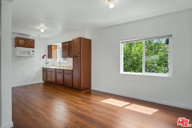 a kitchen with stainless steel appliances a sink and a refrigerator