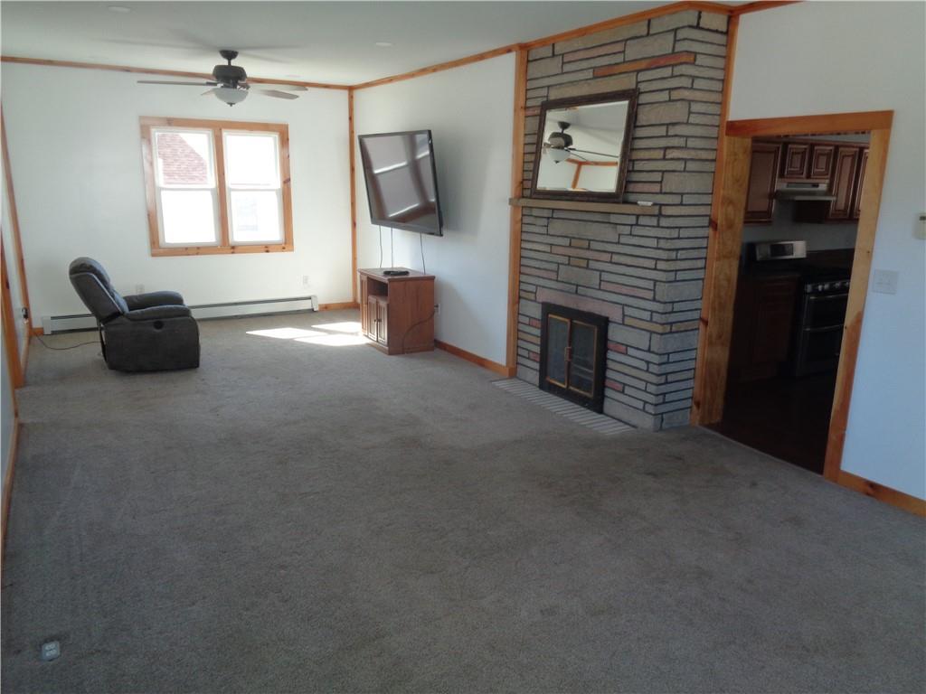 991 Main Street Rimersburg, PA 16248 - Photo 16 of 36 a living room with furniture and a fireplace