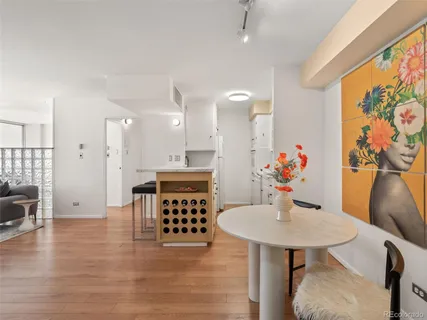 a view of a dining room with furniture and wooden floor
