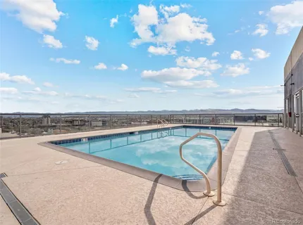a view of a swimming pool and lounge chair